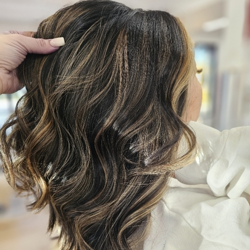 A close up of a person with long hair